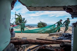 Gia Lai Border Guards Assist Locals in Recovery Efforts